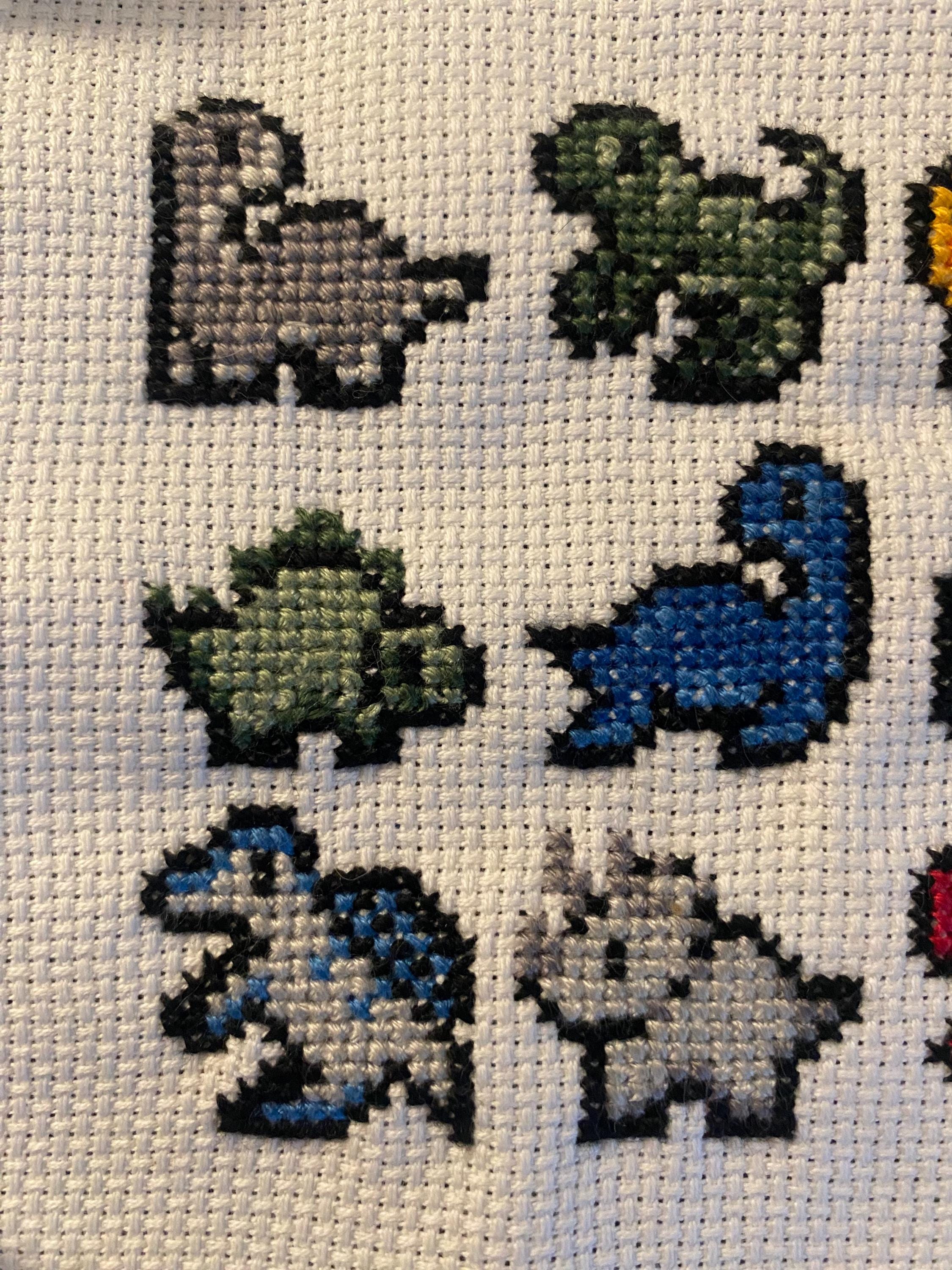 Modèle de point de croix petits dinosaures