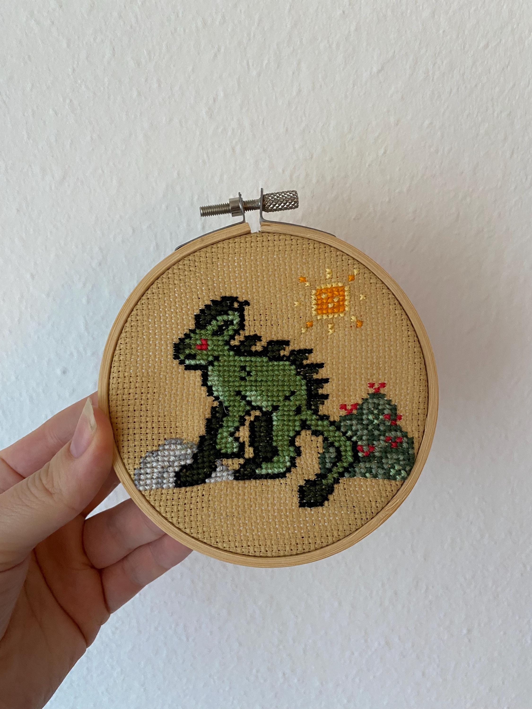 Modèle de point de croix chupacabra pixel art