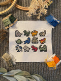 Modèle de point de croix petits dinosaures