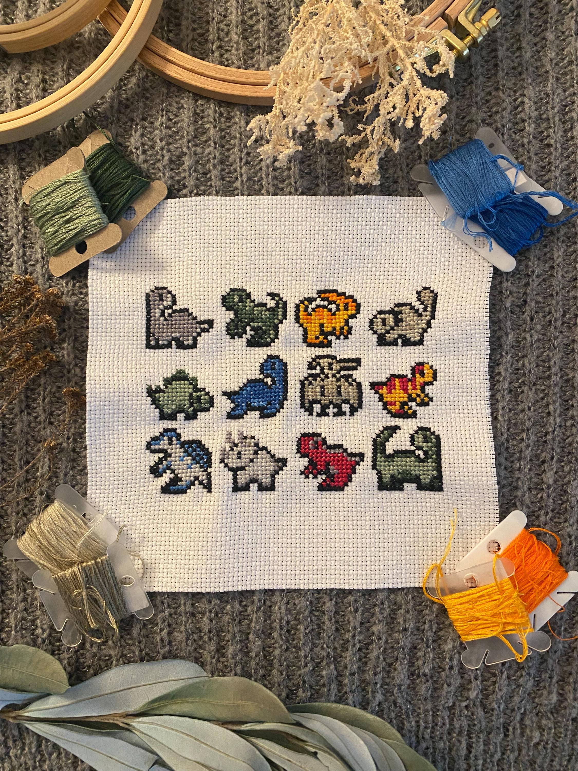 Modèle de point de croix petits dinosaures