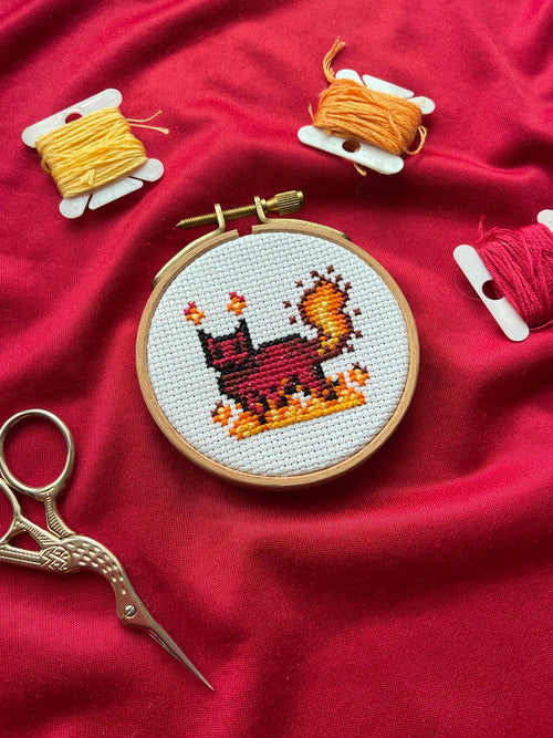 Modèle de point de croix chat de feu pixel art